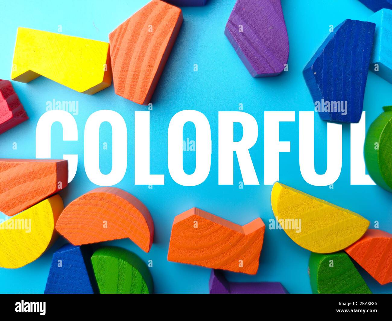 The Colored wooden block with the word "COLORFUL" on a blue background ...