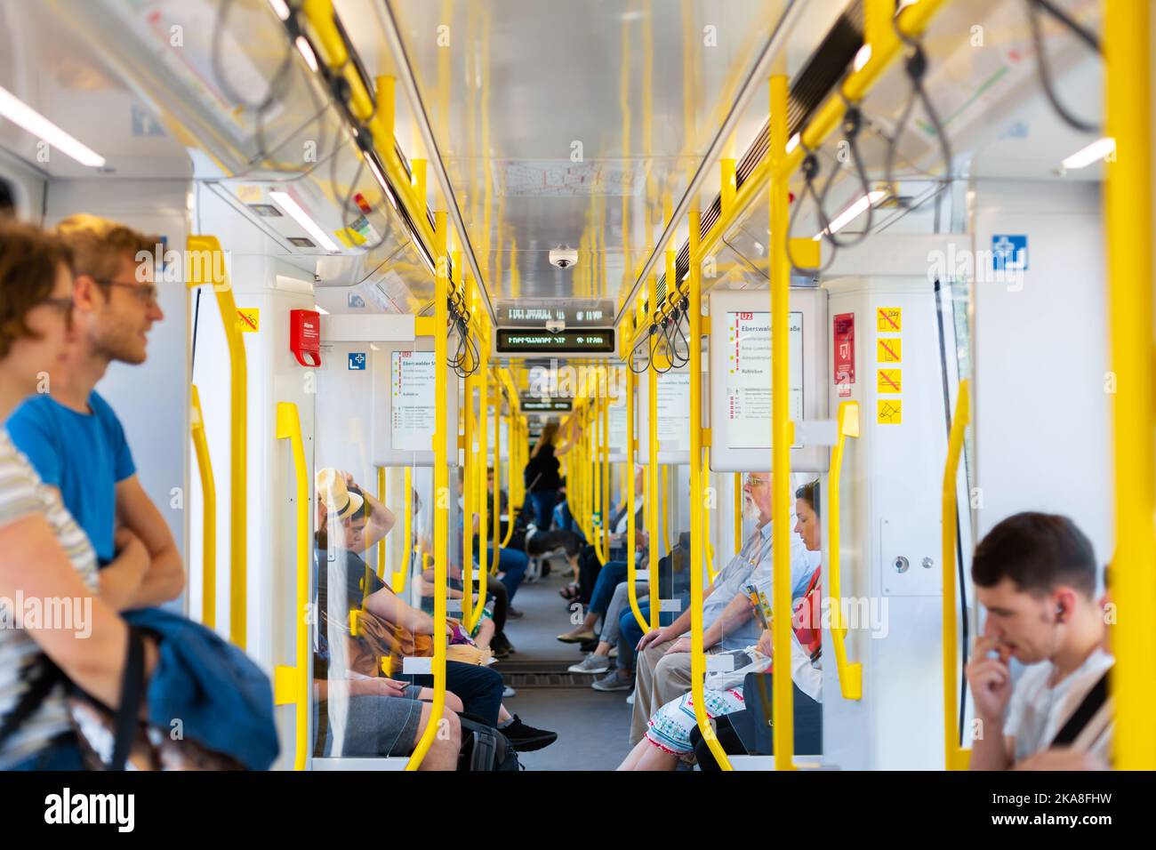 Hand Rails Subway Interior of a modern subway car with yellow handrails. Berlin, Germany ...