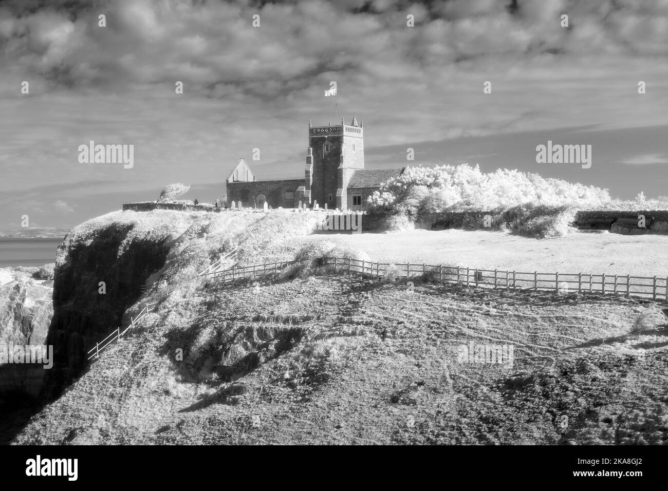 An infrared photograph of the Old Church of St Nicholas on the top of Uphill Cliff, North Somerset, England. Stock Photo