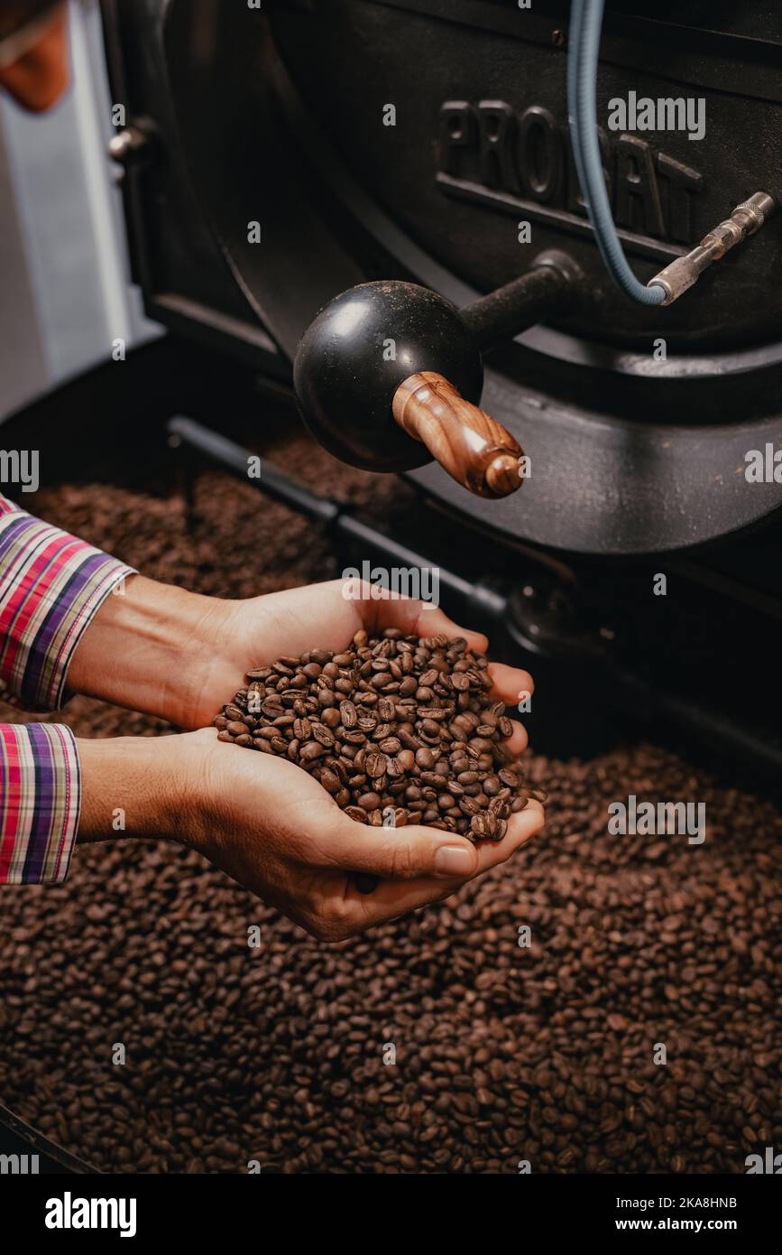 Roasting coffee beans with roaster machine Stock Photo Alamy