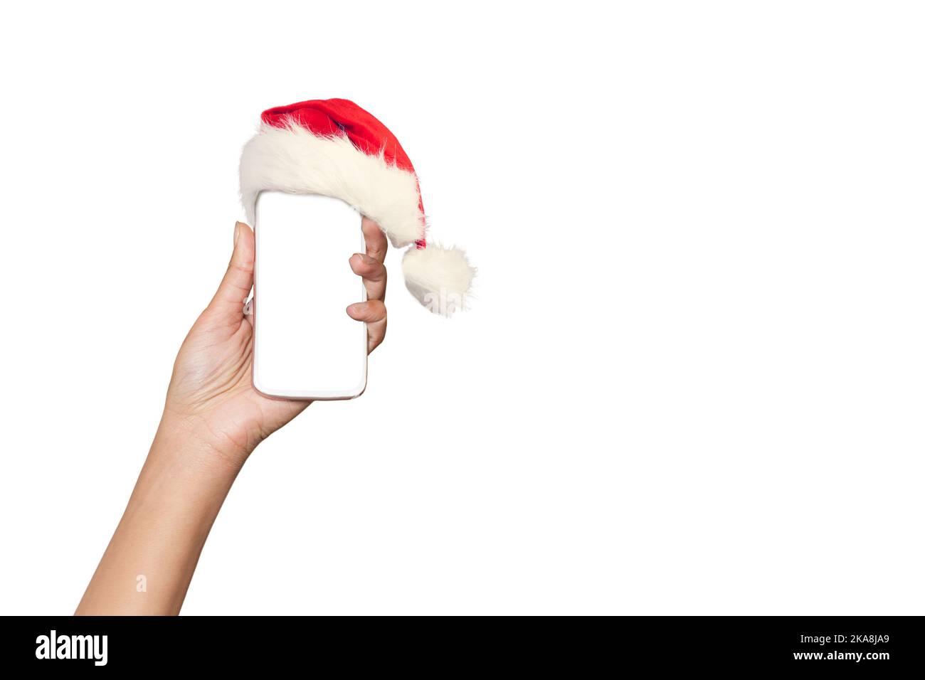 Mobile phone blank screen with a Santa hat on a white background Stock Photo