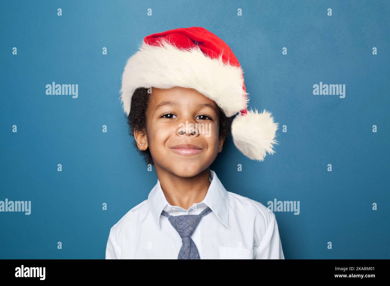 Adorable child boy in New Year hat smiling portrait Stock Photo - Alamy