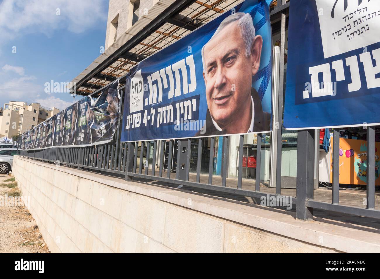 A line of banners promoting opposition leader Binyamin 'Bibi' Netanyahu and his 'Likud' (unity) party, on a wall near a ballot station, as Israel votes for the 5th time since 2019. Stock Photo