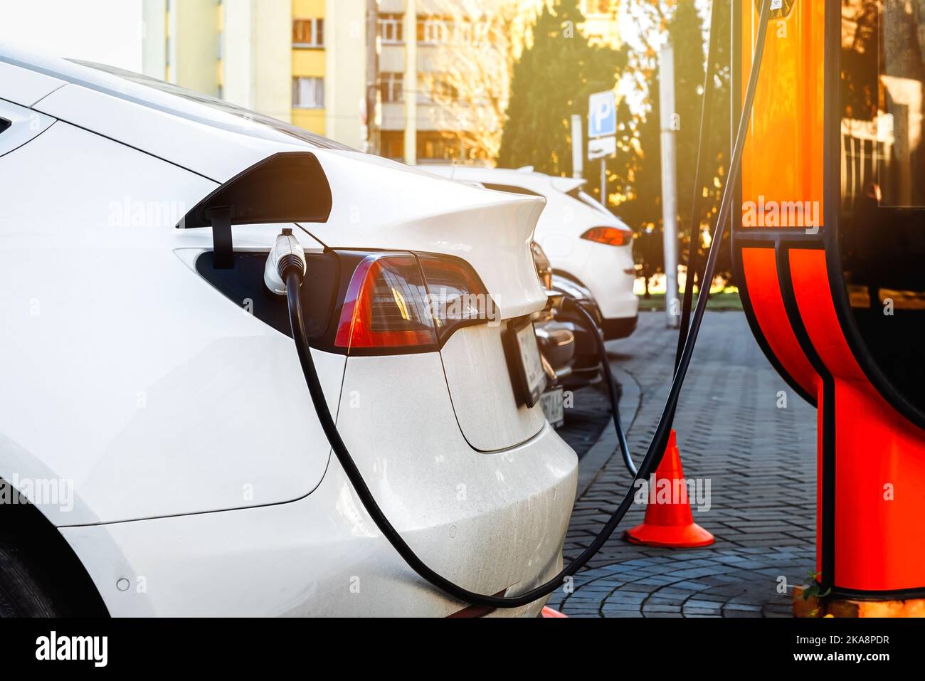 Electric car at the charging station. Ecology. Eco-friendly transport ...