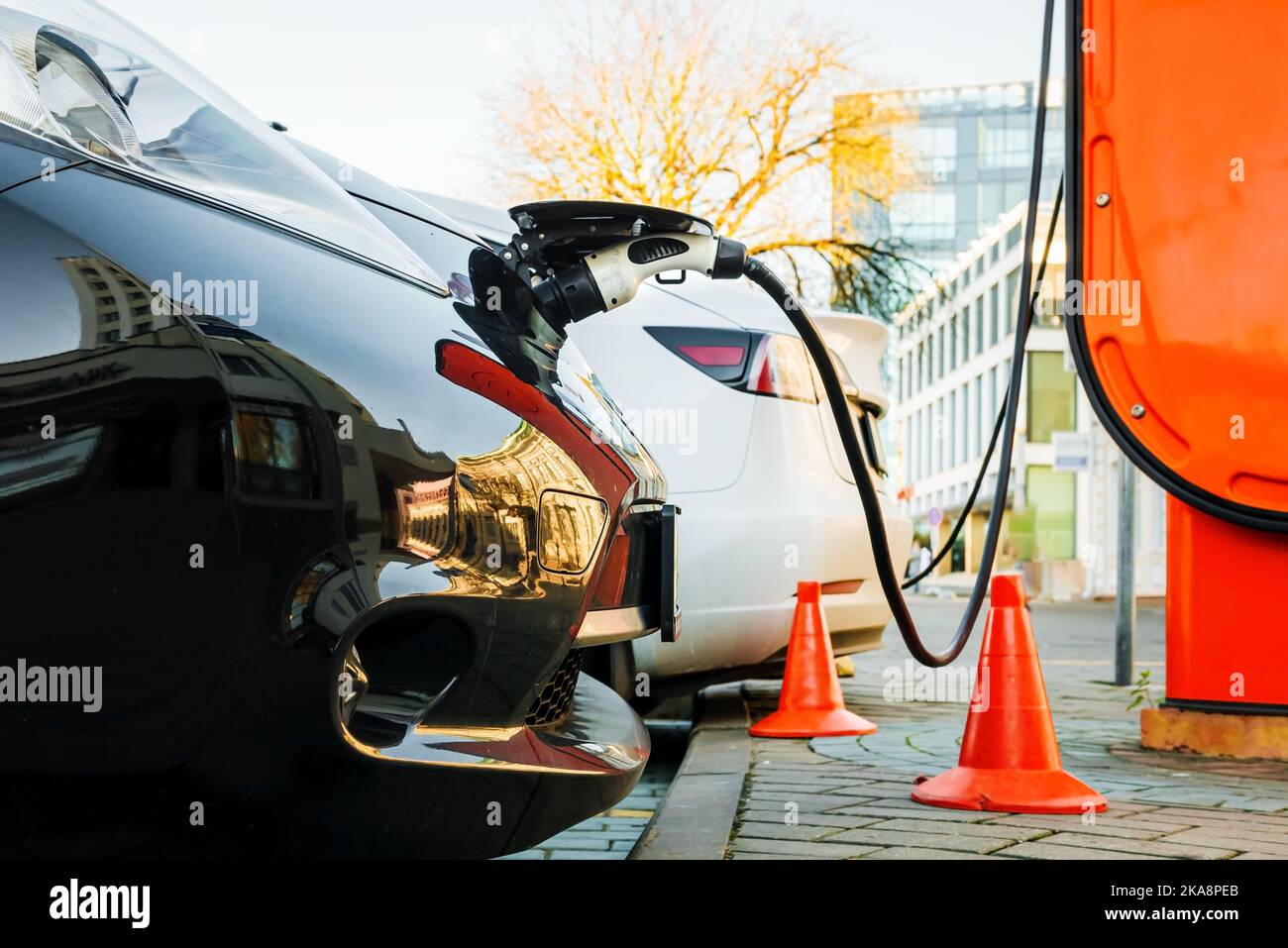 Electric car at the charging station. Ecology. Eco-friendly transport ...