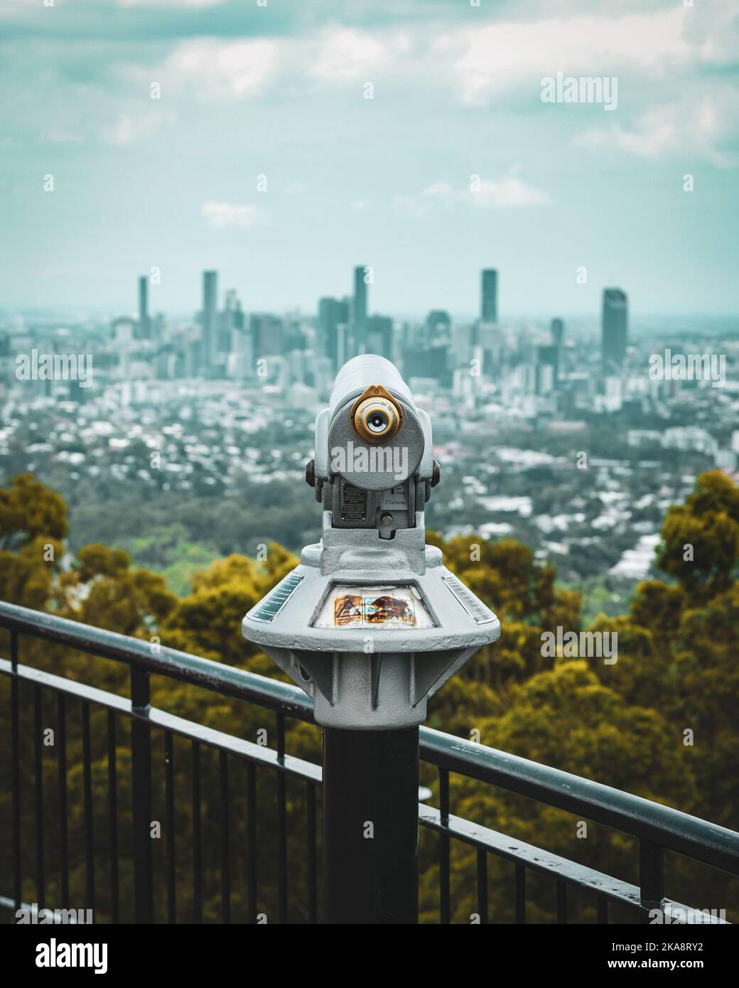 A telescope on Mount Coottha overlooking the cityscape of Brisbane in