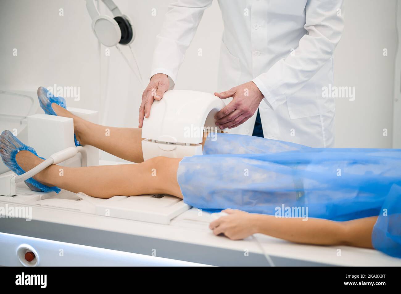 Gray-haired mature medical specialist working with MRI scanner Stock Photo