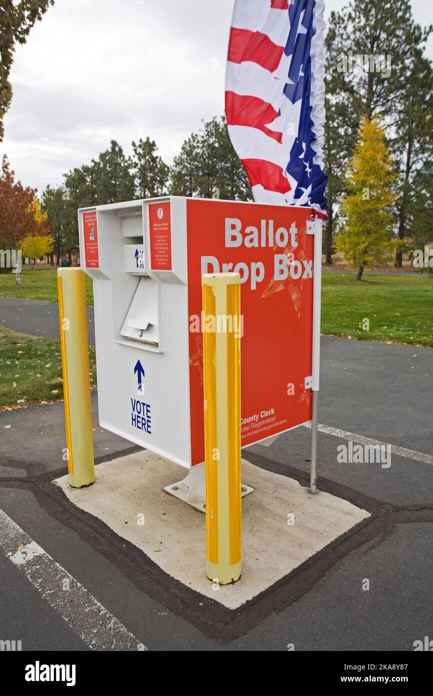 October, 2022. A ballot drop box in which Oregon voters can drop their signed ballots they received by mail. Oregon is completely Vote By Mail. This one is in Deschutes County, Bend, Oregon at a local elementary school. Stock Photo