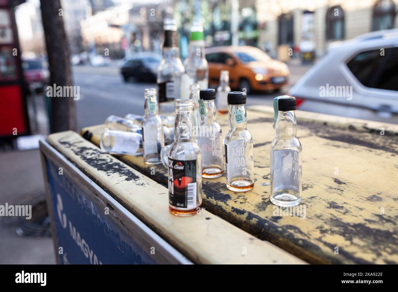 Picture of a bunch of empty alcohol bottles, miniatures, scattered in a
