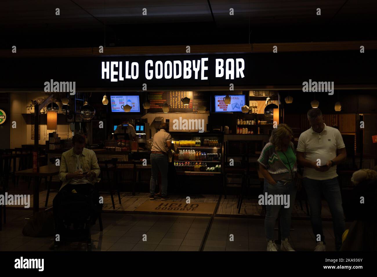 A group of people in the Hello Goodbye Bar in Amsterdam Airport Schiphol Stock Photo