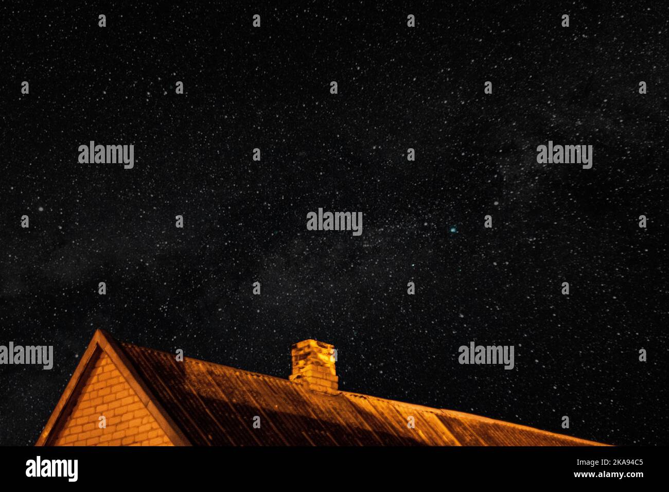 The roof of the house under a starry sky Stock Photo - Alamy