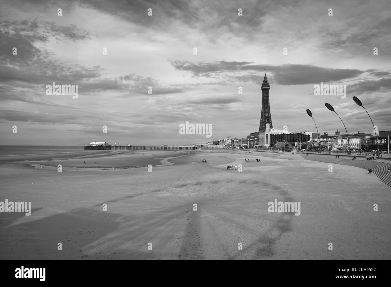 Reflections of the big wheel on Blackpools central pier looking towards Blackpool tower Stock Photo