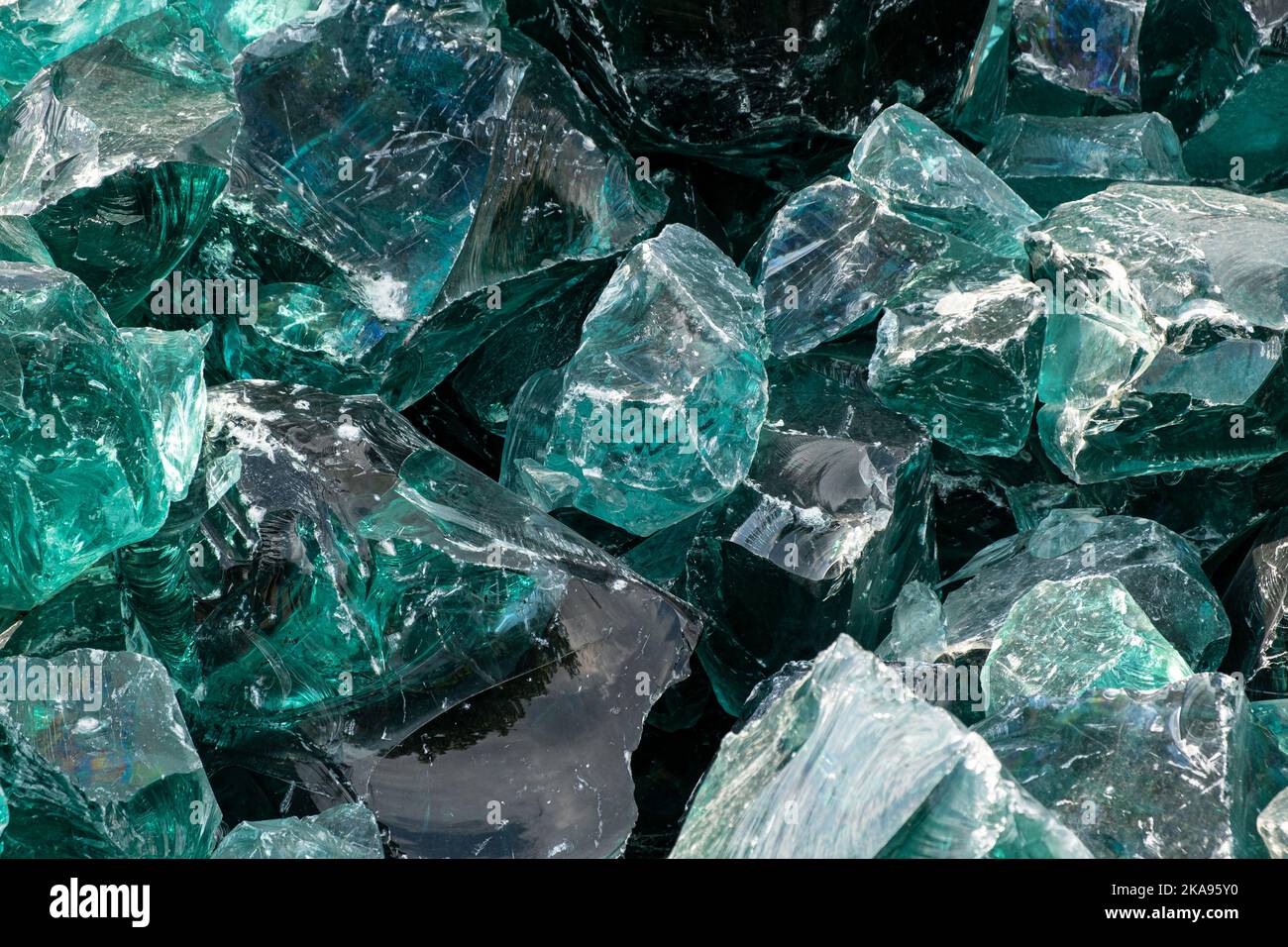 Heap of large Chunk of Aqua Glass Rock Slag for Garden decor. Glass in Nature Full frame texture top view Stock Photo