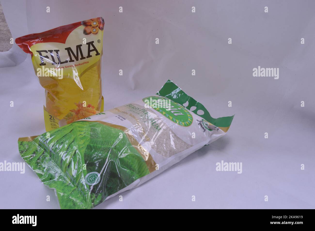 Packaged rice and cooking oil on a white background Stock Photo