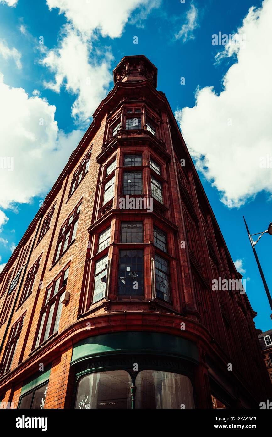 The vertical panoramic shot of a high brick building facade Stock Photo ...