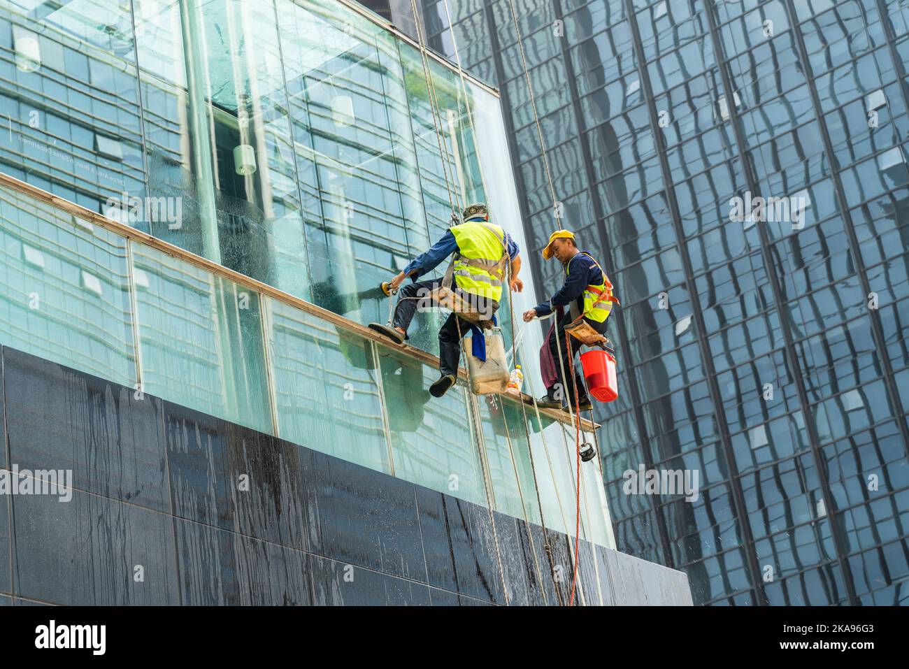 Picture of Chongqing, China-July 20th, 2021: chinese worker cleaning windows ...