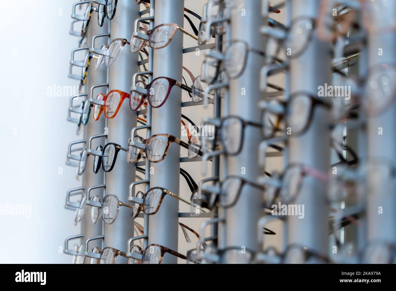 Designer spectacles or glasses frames on display in an opticians store