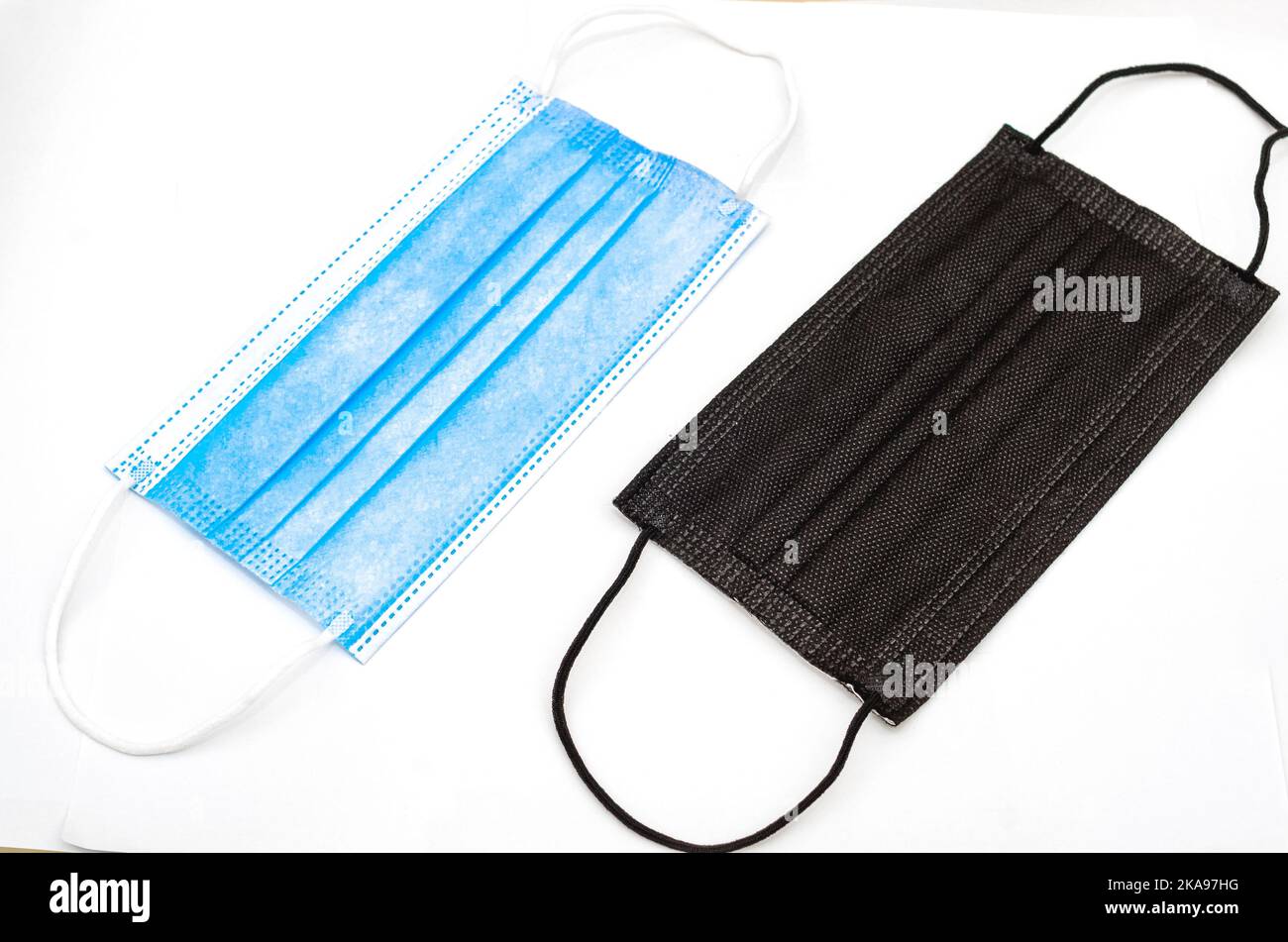 The two protective face masks isolated on white background Stock Photo ...