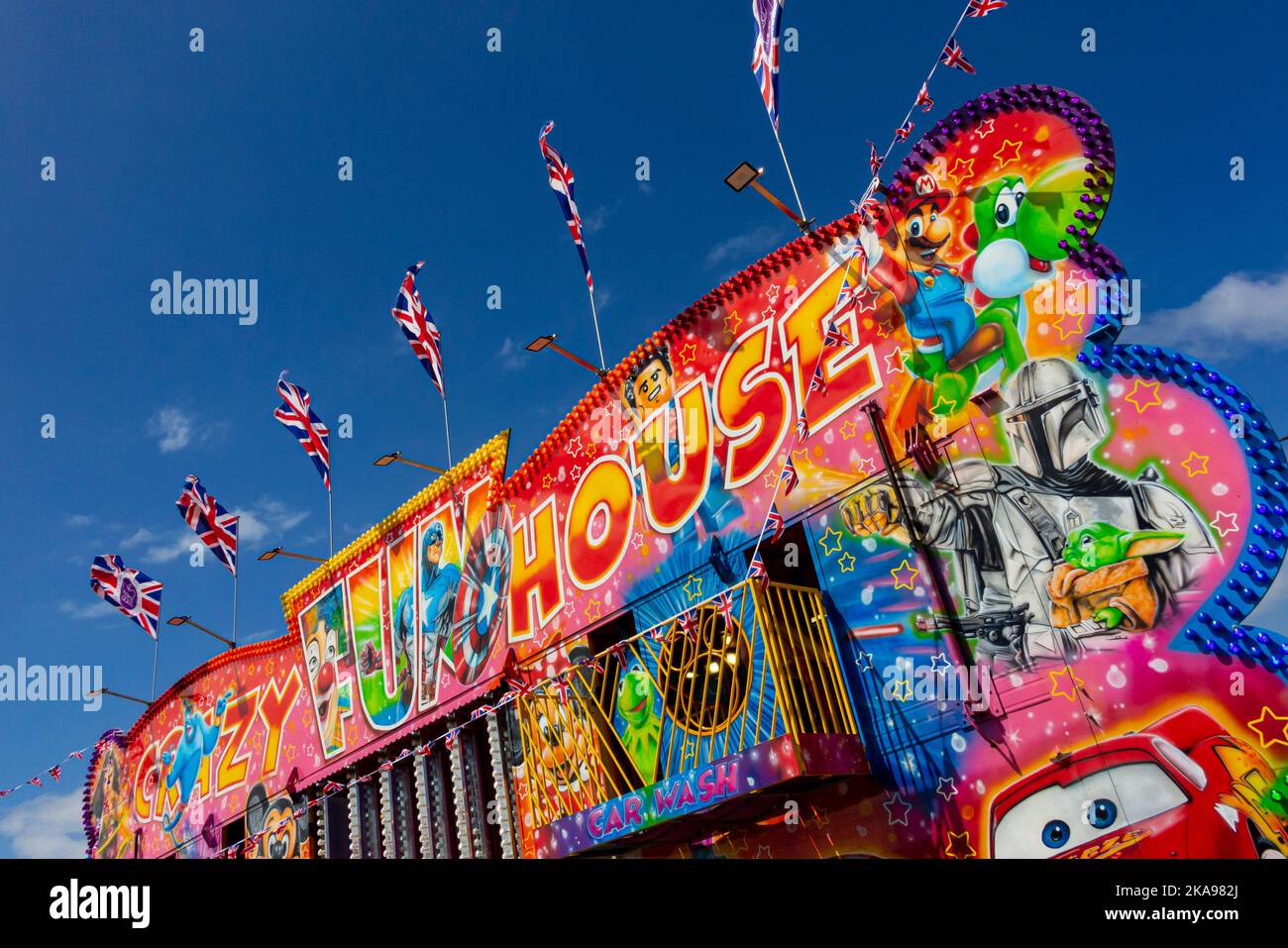 Traditional funfair fun house at a fairground near Hunstanton beach in west Norfolk on the east coast of England UK. Stock Photo