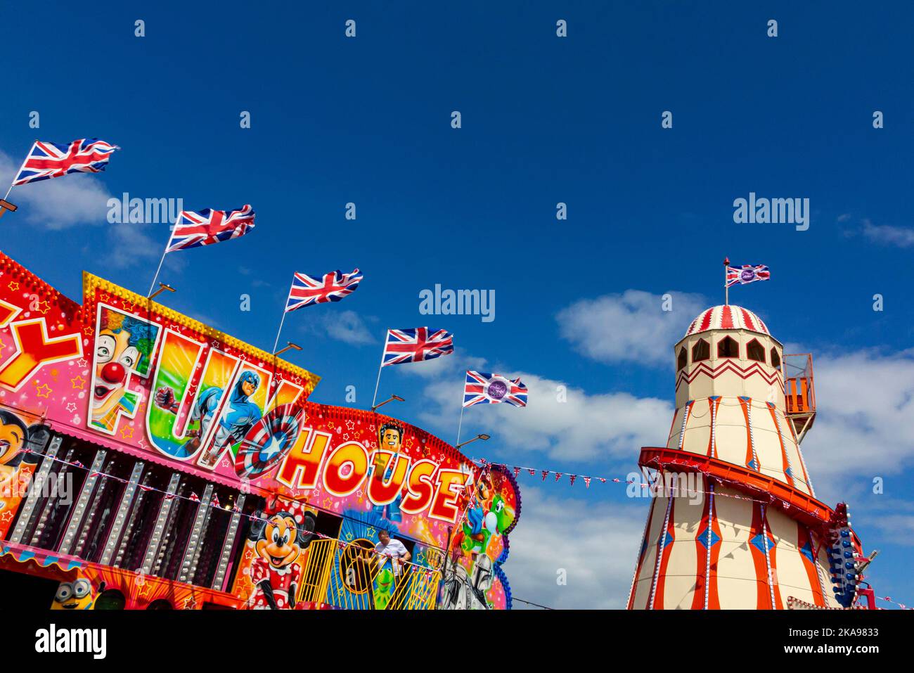 Traditional funfair rides at a fairground near Hunstanton beach in west Norfolk on the east coast of England UK. Stock Photo