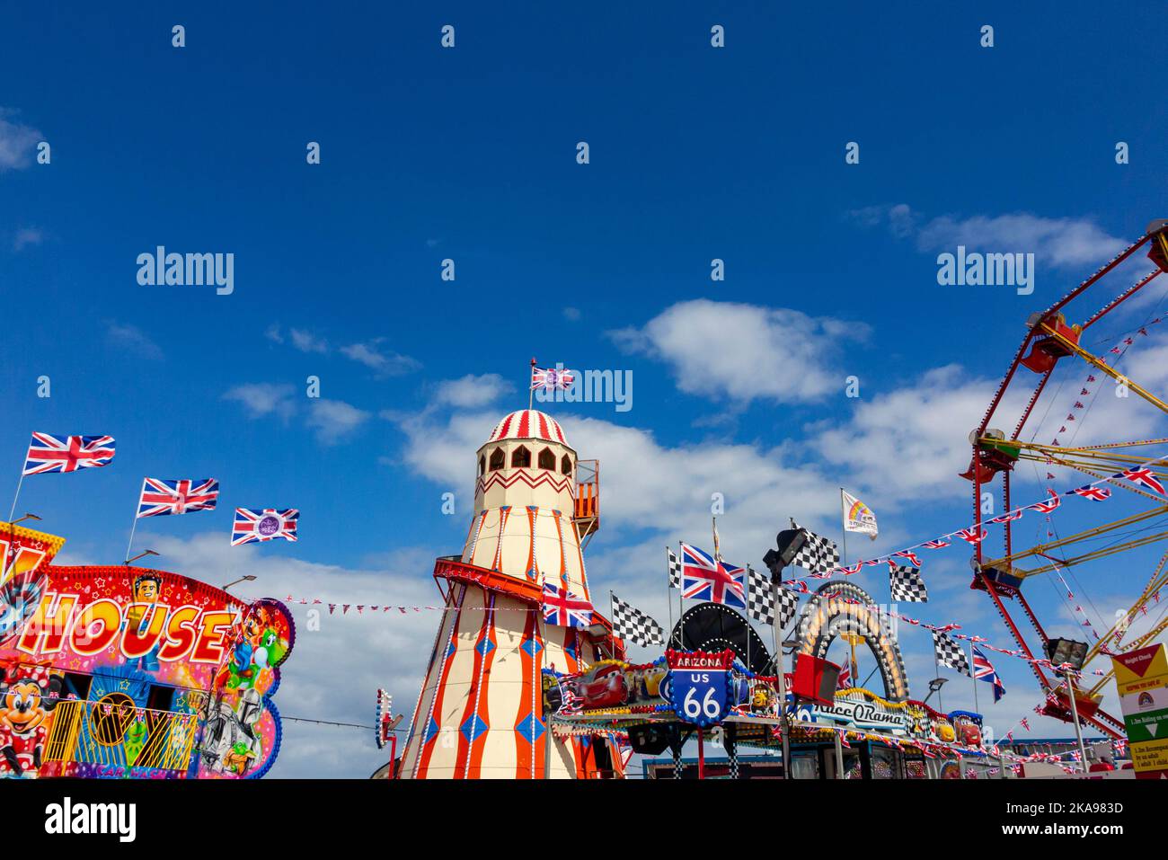 Traditional funfair rides at a fairground near Hunstanton beach in west Norfolk on the east coast of England UK. Stock Photo