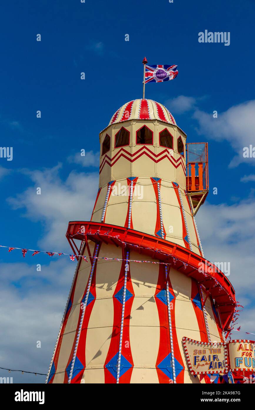 Helter skelter funfair rides at a fairground near Hunstanton beach in west Norfolk on the east coast of England UK. Stock Photo