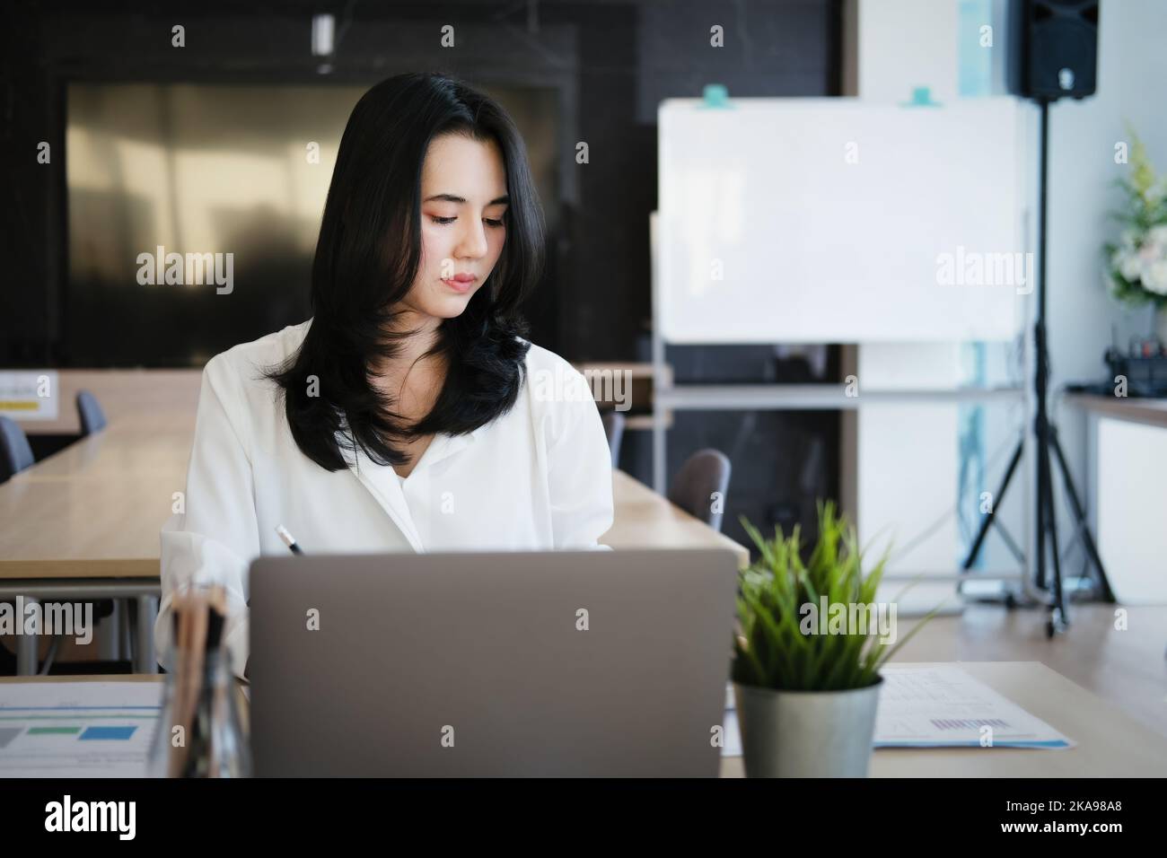 new normal, a businesswoman uses a computer to work for a company Via