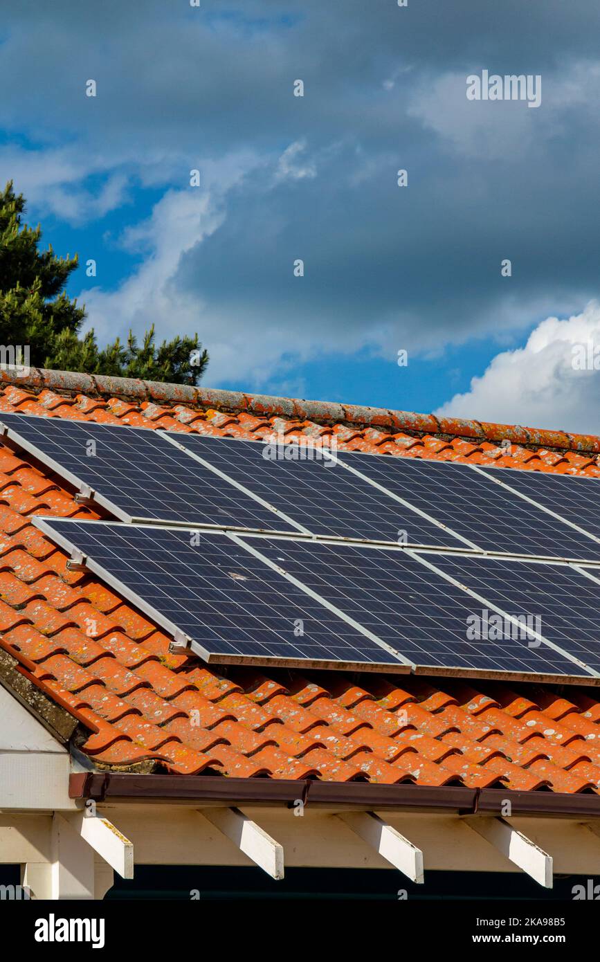 Photovoltaic solar panels on the roof of a building in Norfolk England UK. Stock Photo