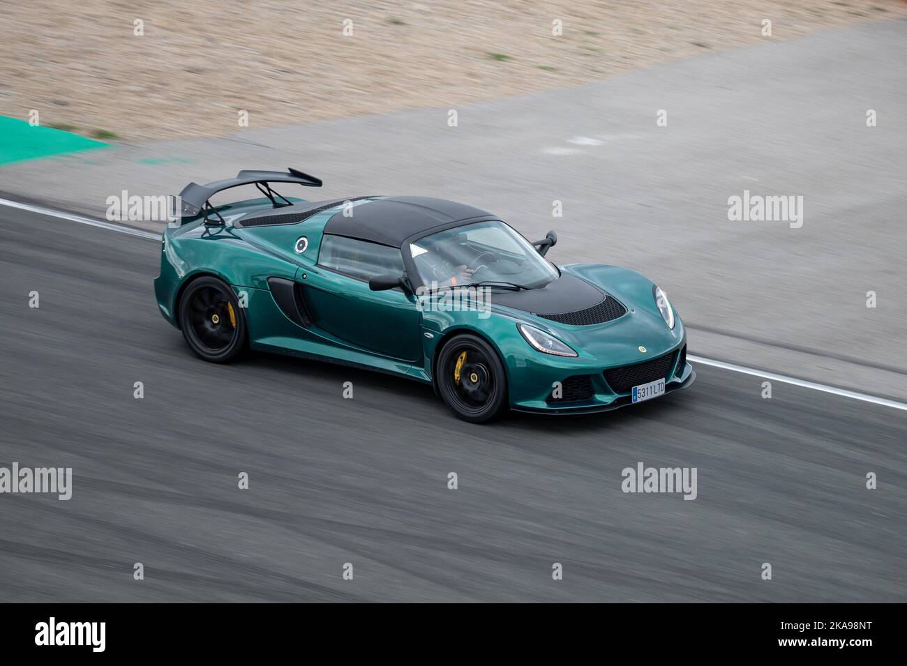 Lotus Exige racing around the race circuit Stock Photo - Alamy