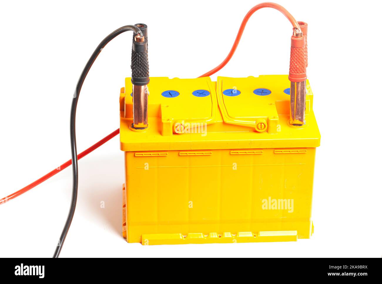 Charging the car acid battery. The charger terminals are connected to