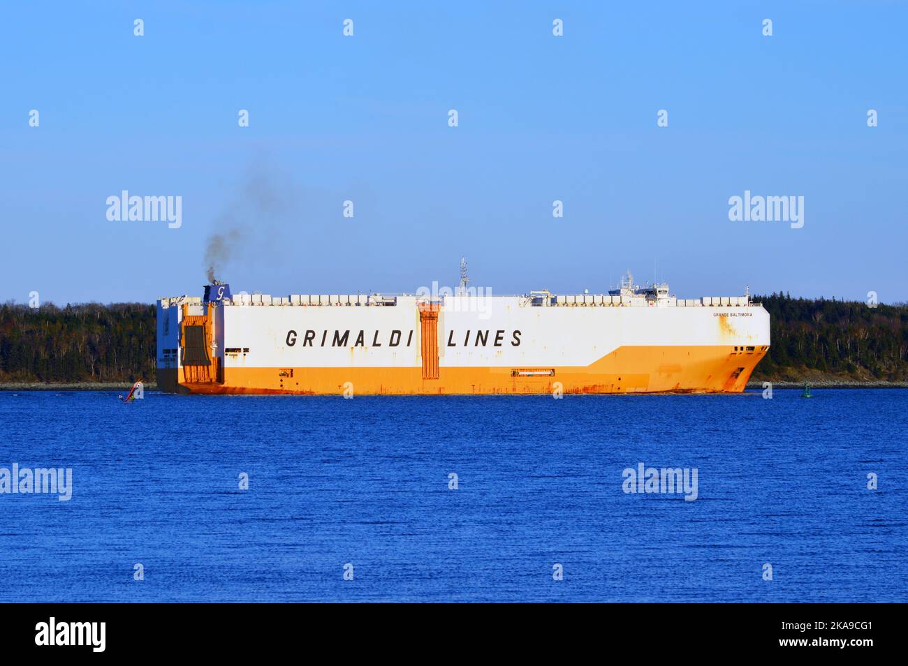 Grande Baltimora (IMO 9784037, MMSI 247375700), a car carrier ship (vehicle carrier) of Grimaldi Lines, pictured leaving Halifax Harbour in October 2022. Stock Photo