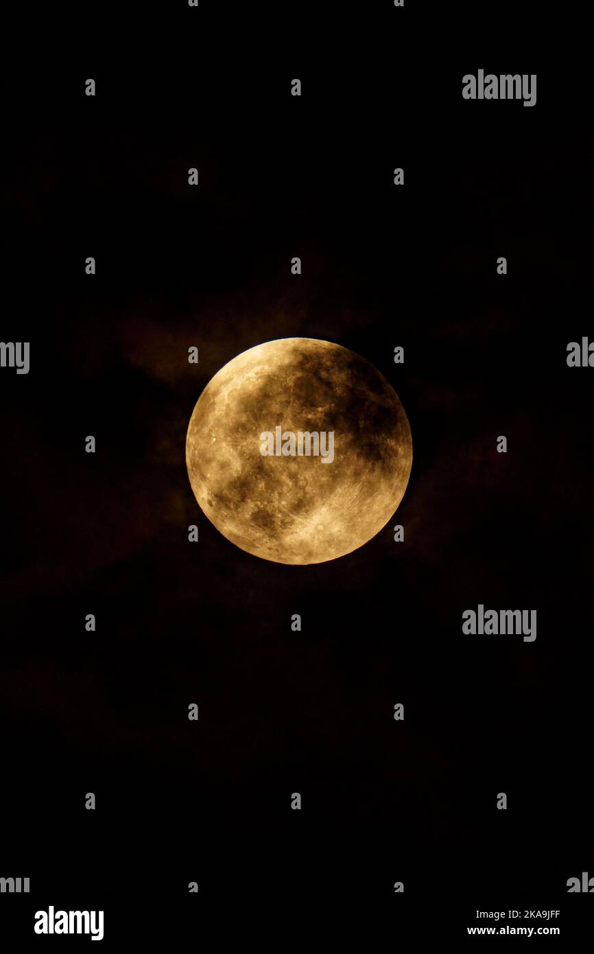 Glowing full moon in a dark sky Stock Photo - Alamy