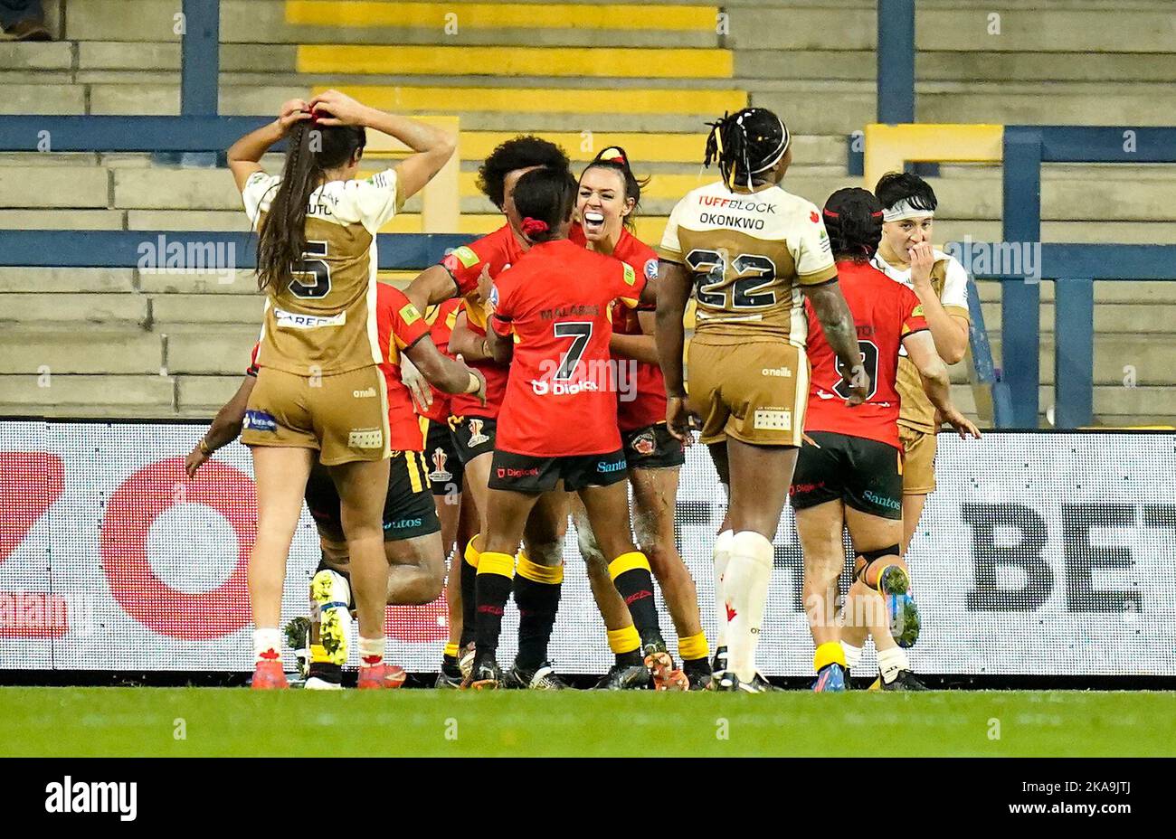 Papua New Guinea's Anika Butler (centre) celebrate scoring their side's ...