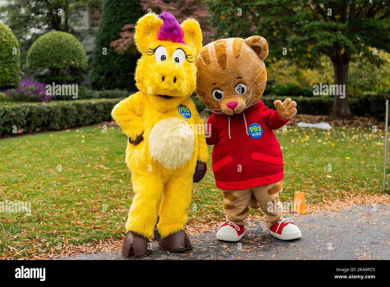 Washington, United States Of America. 31st Oct, 2022. Washington, United States of America. 31 October, 2022. Costumed characters from Public Broadcasting, Daniel Tiger, right, and Donkey Hodie attend the annual Halloween celebration on the South Lawn of the White House, October 31, 2022 in Washington, DC The event included children of firefighters, nurses, police officers and National Guard members. Credit: Adam Schultz/White House Photo/Alamy Live News Stock Photo