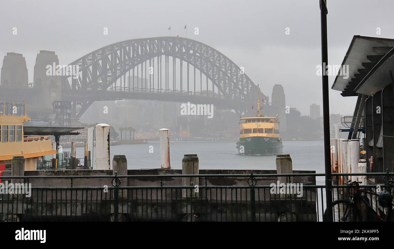 A Sydney ferry harbor bridge wharf on a foggy day Stock Photo - Alamy