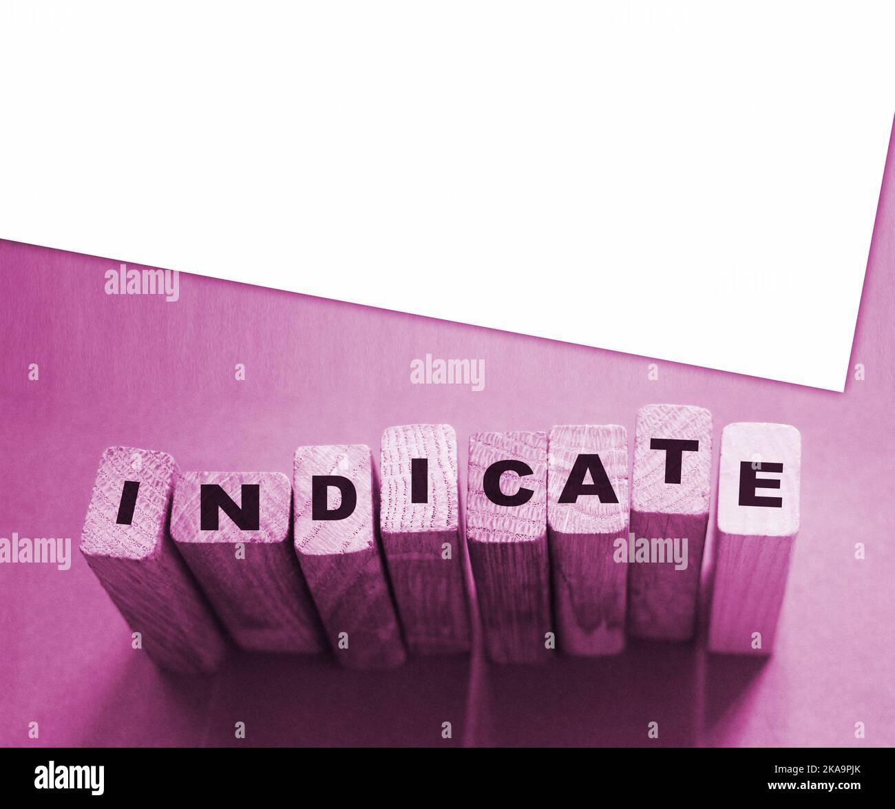 Indicate word on wooden blocks on cyan background. Financial indicator