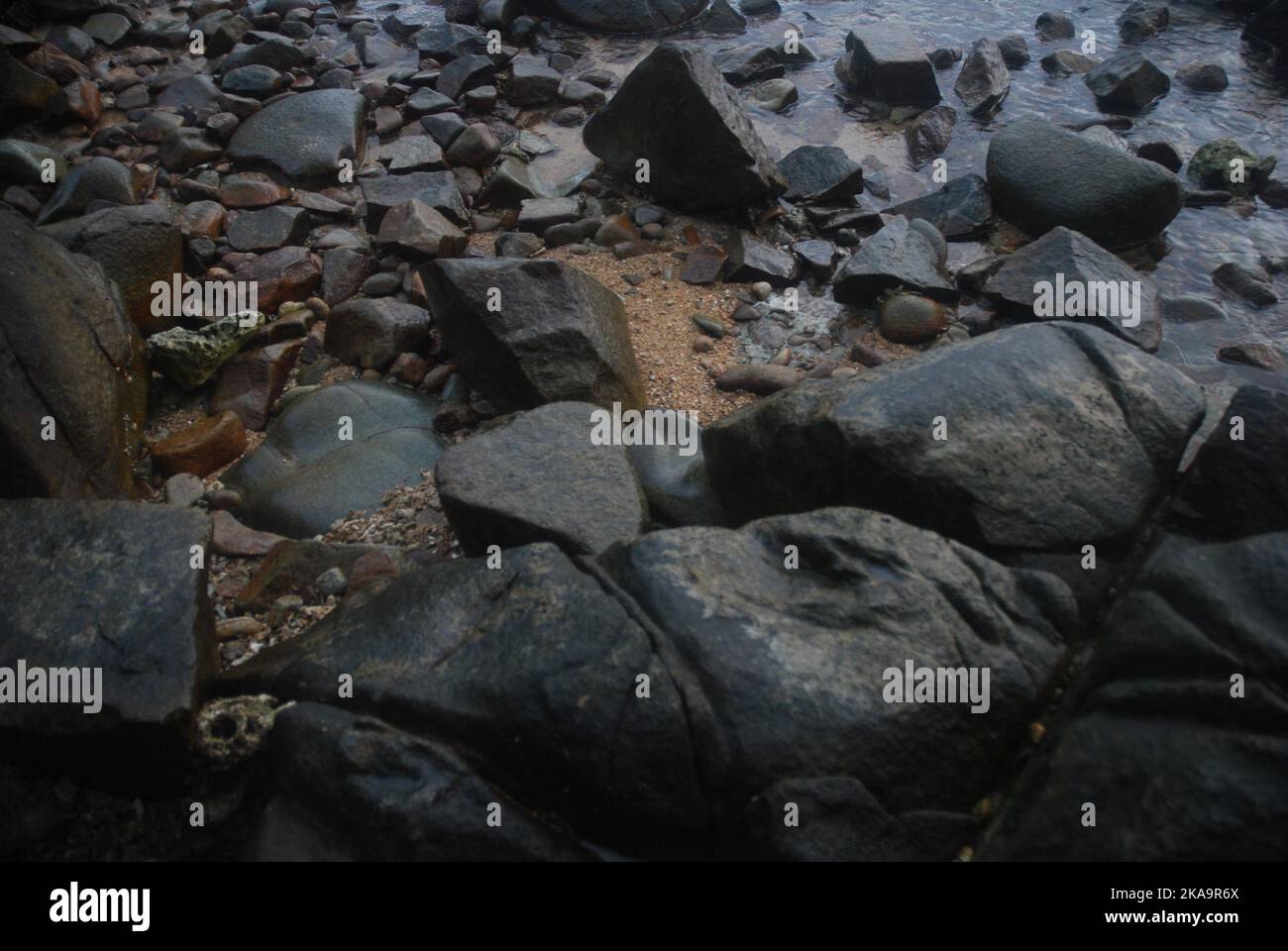 A closeup shot of rock formations on the seacoast Stock Photo - Alamy