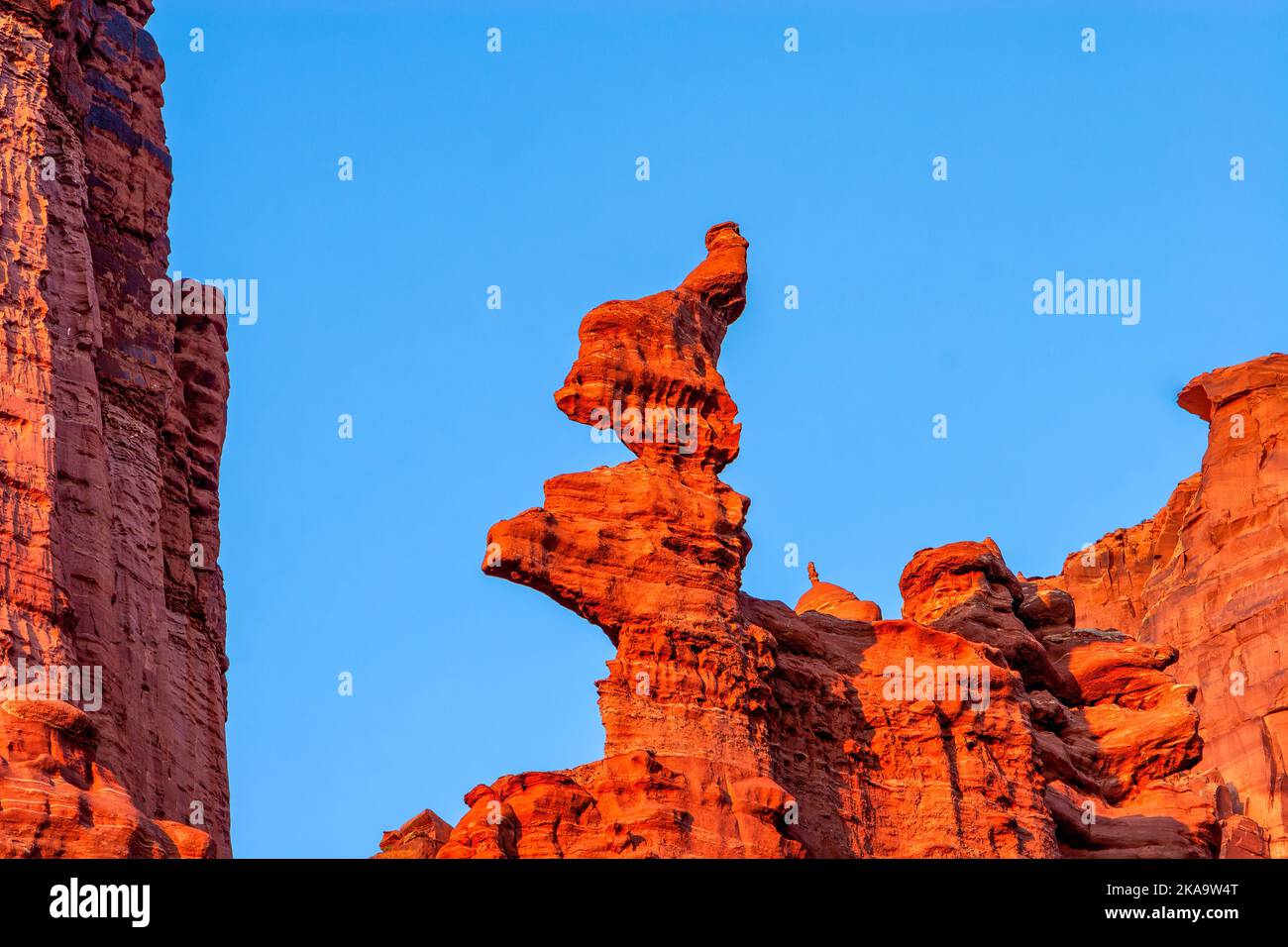 The bizarrely-shaped top of the Cutler sandstone Ancient Art Tower in the Fisher Towers near Moab, Utah.  A popular climing destination. Stock Photo