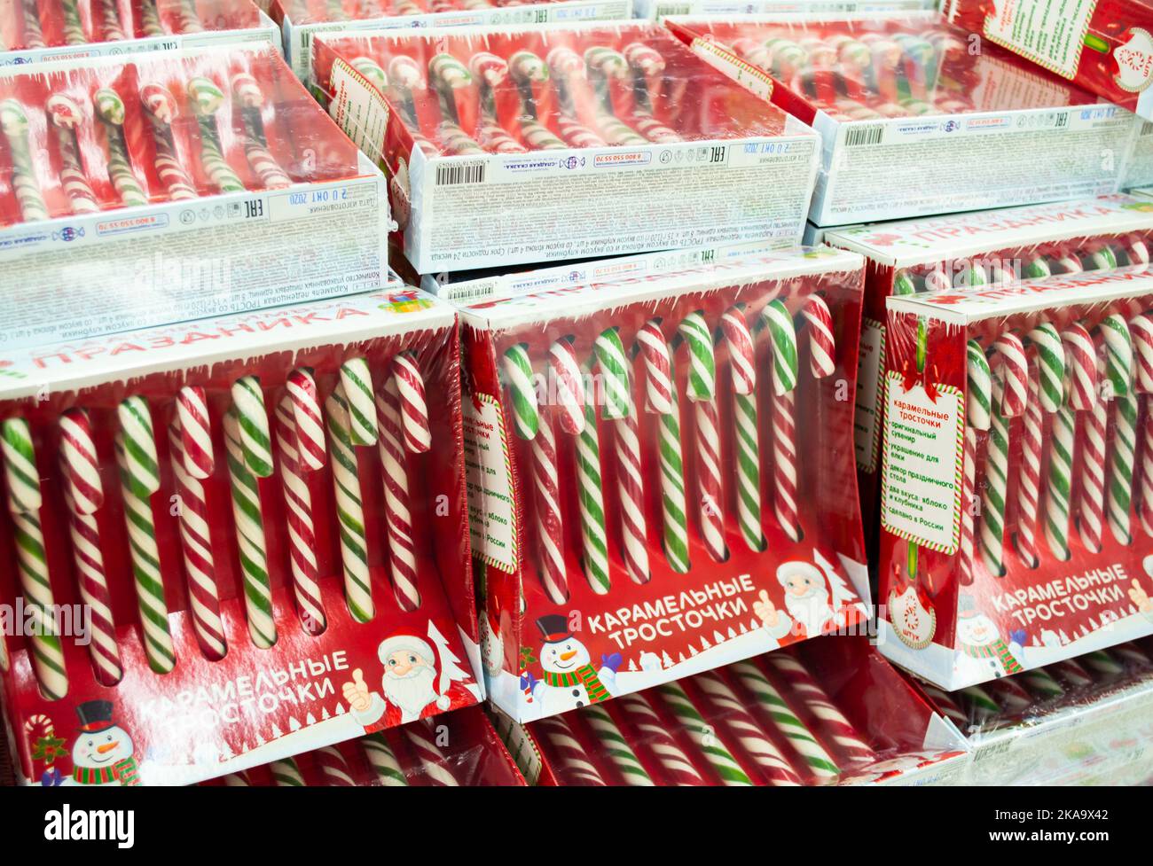 Moscow, Russia, November 2020 Many striped candy canes in boxes