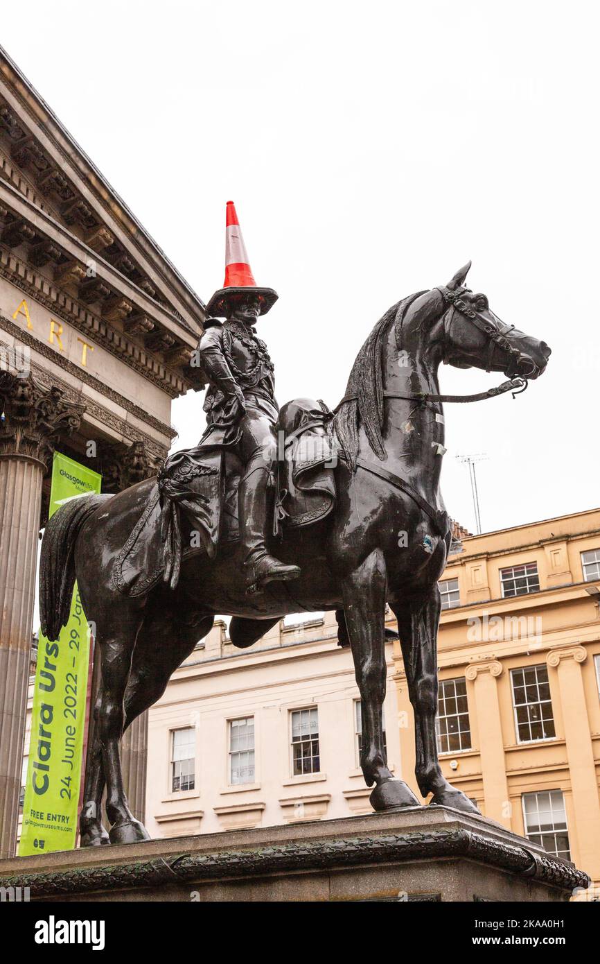 Equestrian statue of the Duke of Wellington, famous for having a traffic cone hat. Glasgow Museum of Modern Art Scotland,Glasgow, United Kingdom. Stock Photo