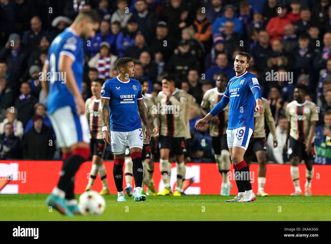 Rangers players look dejected after Ajax's Mohammed Kudus players celebrate their side's second goal of the game, scored by Mohammed Kudos during the UEFA Champions League Group A match at Ibrox Stadium, Glasgow. Picture date: Tuesday November 1, 2022. Stock Photo