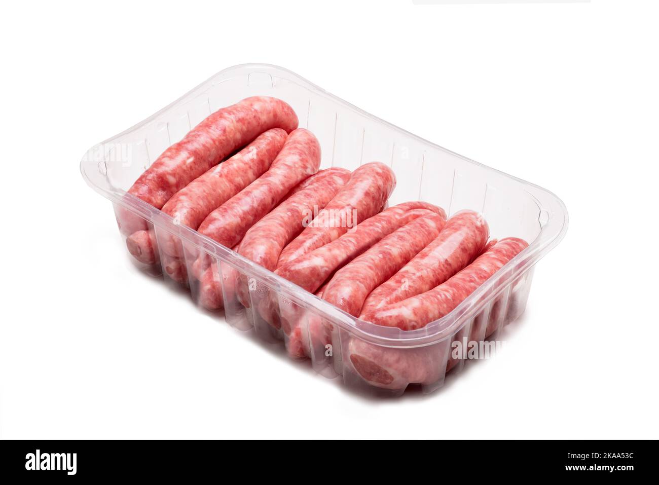 pork sausages packed in transparent plastic tray isolated on white