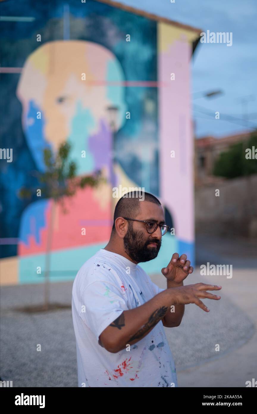 Txemy talks about his artwork during Asalto International Urban Art Festival in Barrio Isabel of Zaragoza, Spain Stock Photo