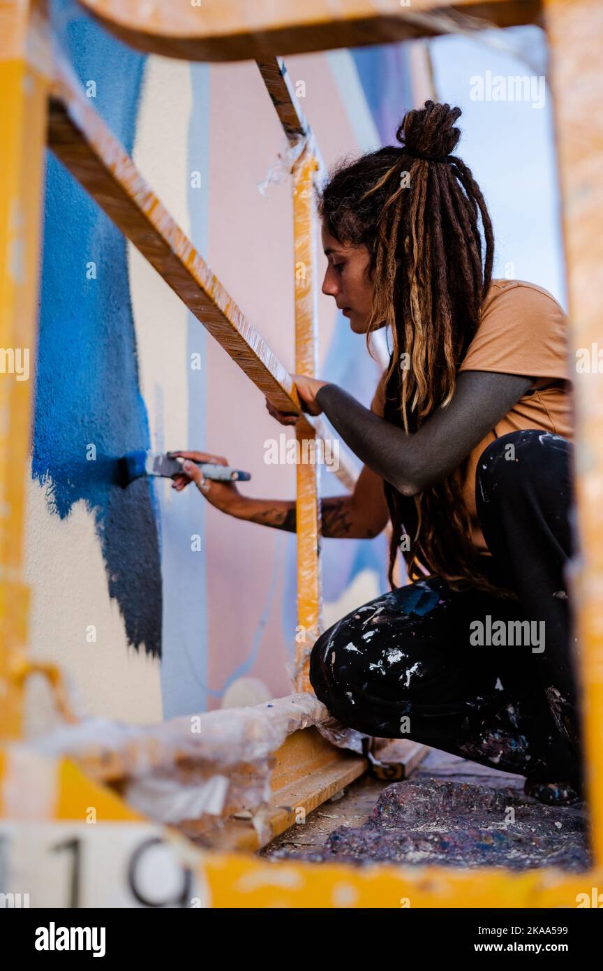 Artist Nulo paints a mural during Asalto International Urban Art Festival in Barrio Isabel of Zaragoza, Spain Stock Photo