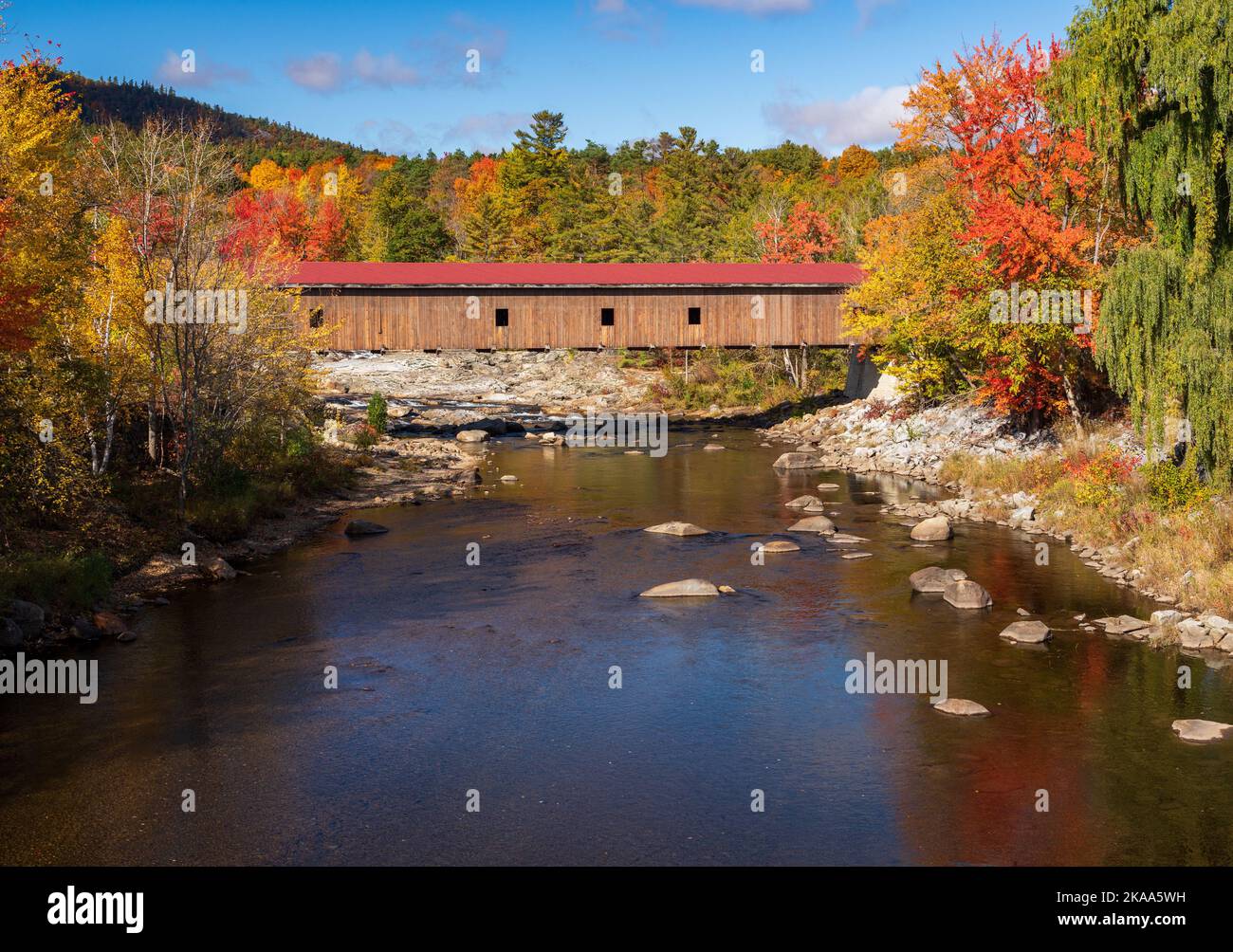 Colorful fall trees in the Adirondacks around Jay covered bridge in New York State in the autumn Stock Photo