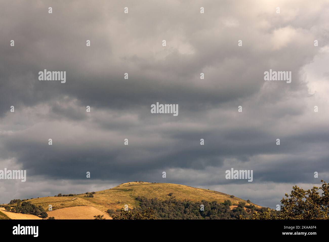Top view of the french hills on the cloudy sky. Nature scenery along the Chemin du Puy. Way of Saint James Stock Photo