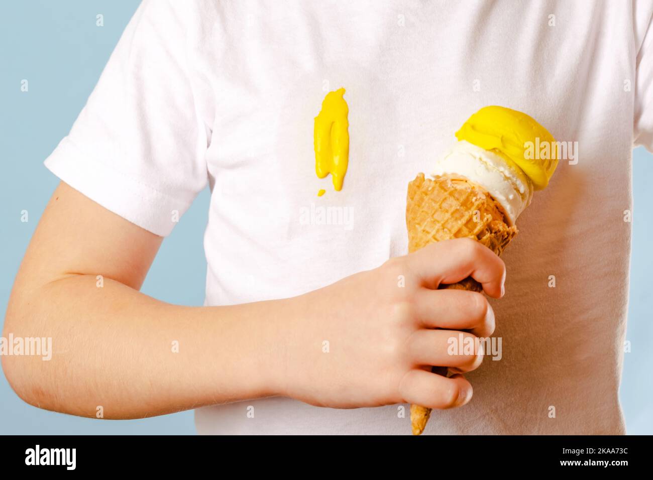 Close up a dirty ice cream stain on a white tshirt. Ruining clothes