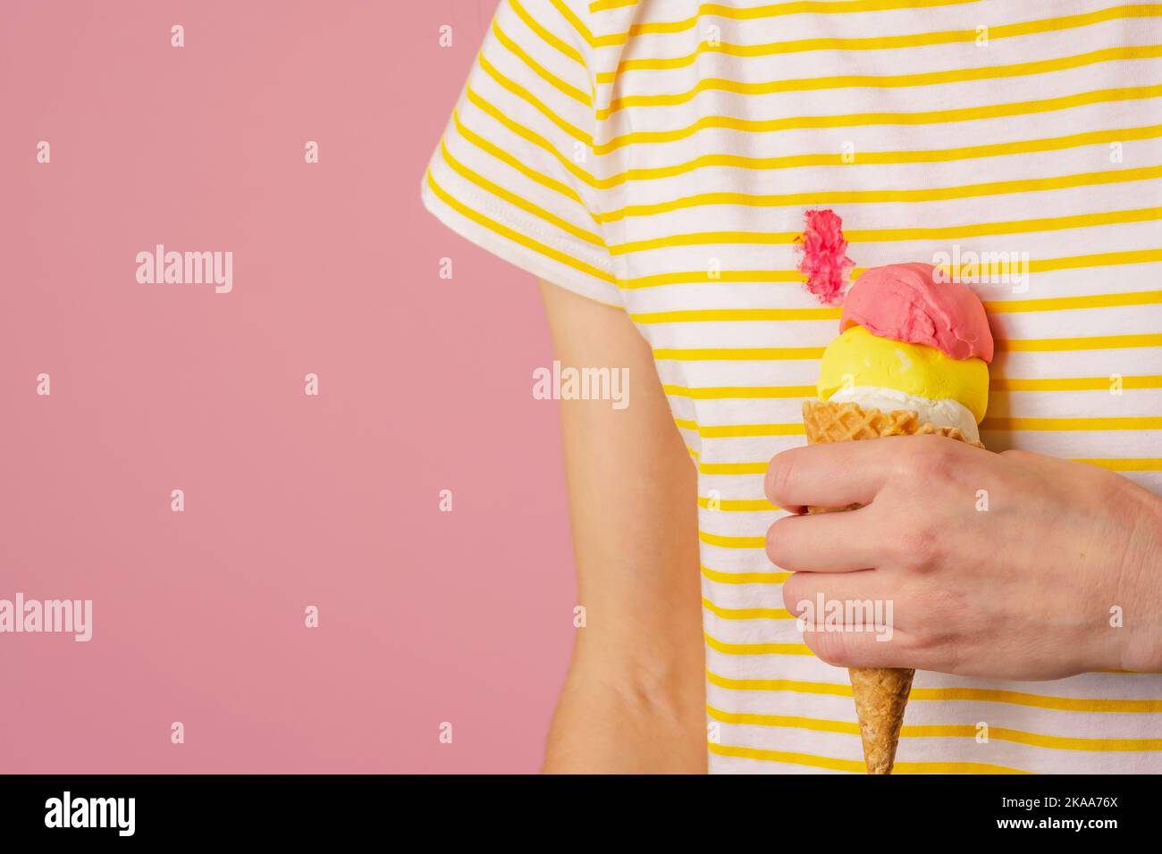 Spilling pink ice cream on clothes. daily life stain concept Stock