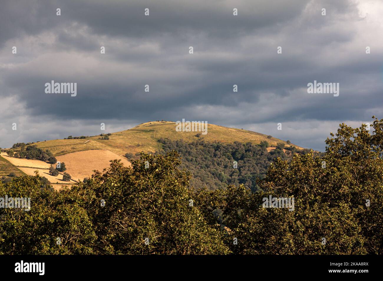 Top view of the french hills on the cloudy sky. Nature scenery along the Chemin du Puy. Way of Saint James Stock Photo