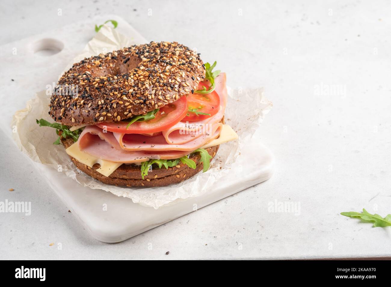 bagel filled with ham, cream cheese and tomato Stock Photo Alamy